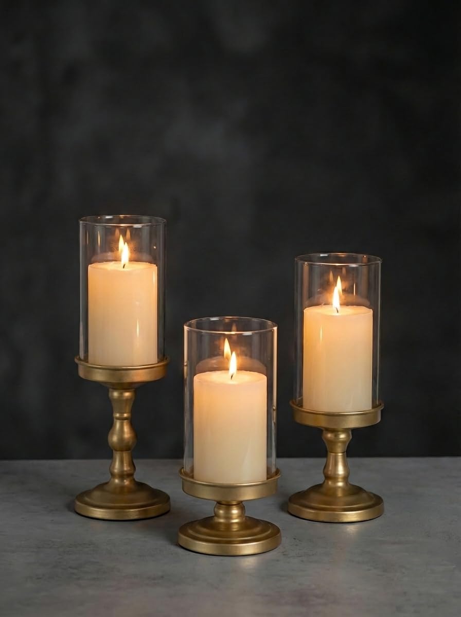 Nuptio hurricane glass candle holder base in gold adds refined ambiance.