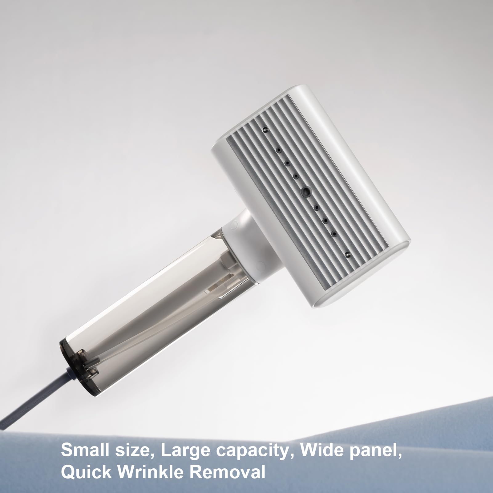 nxuoo G10 steamer in-action with hanging garment demonstrates fast wrinkle removal.