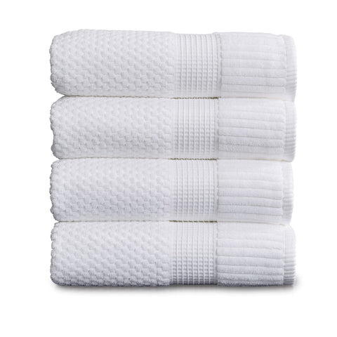 NY Loft four-piece white bath towel set with soft plush texture.