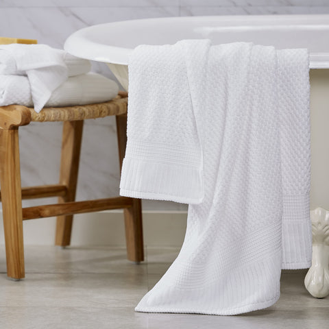 NY Loft white towels displayed on a rack for a timeless look.