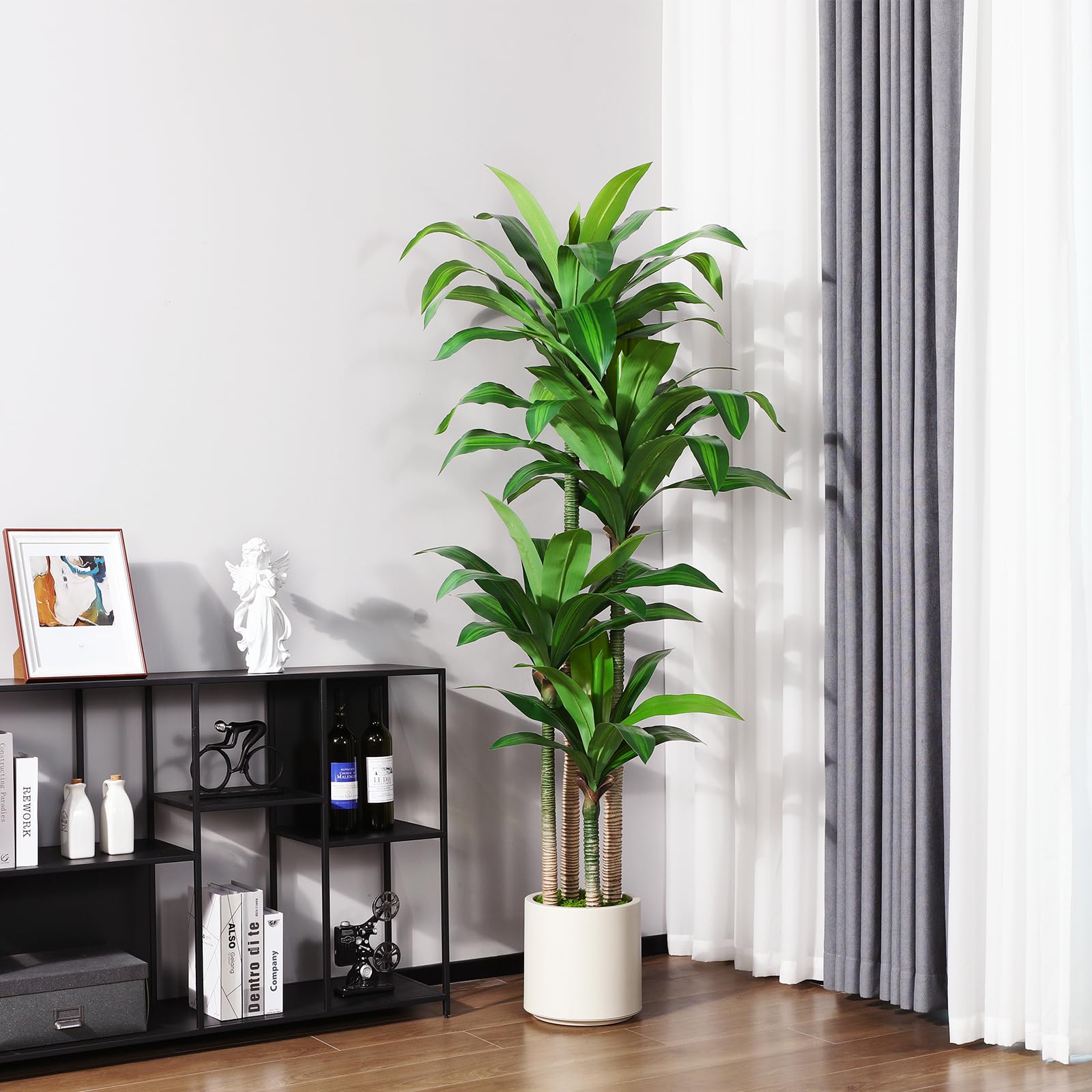 Oakred dracaena tree assembly via leaf insertion for easy setup.