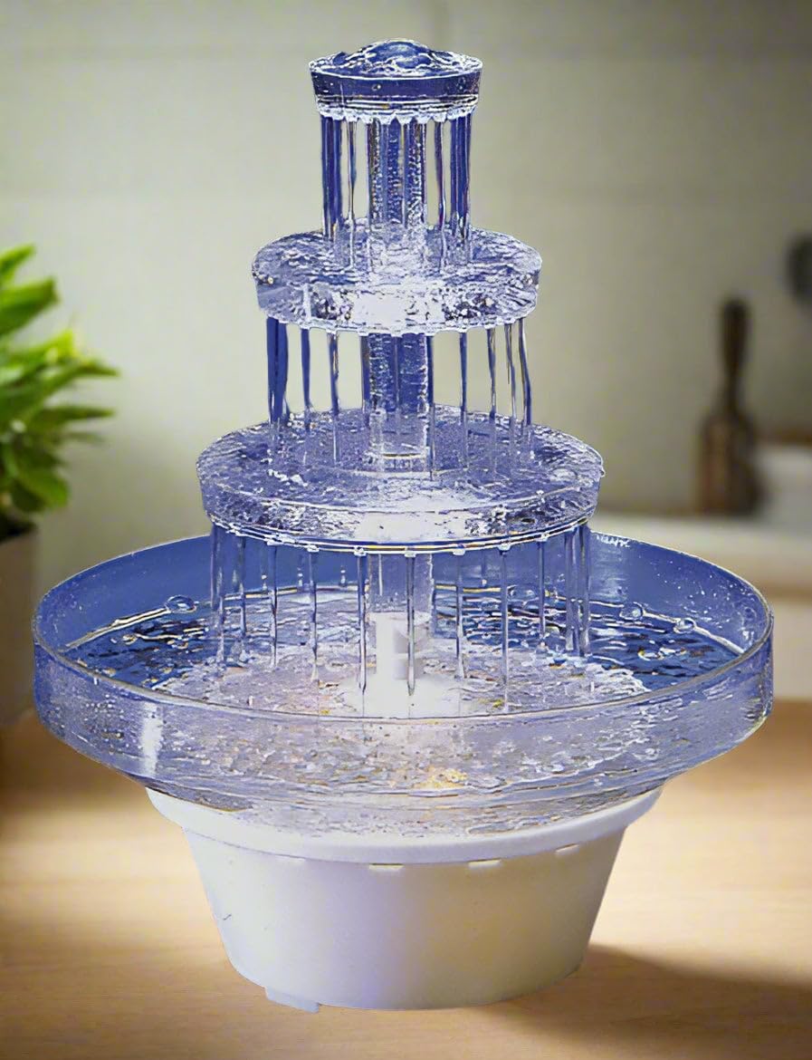 Oasis Supply lighted 3-tier fountain creates a dramatic wedding cake centerpiece.