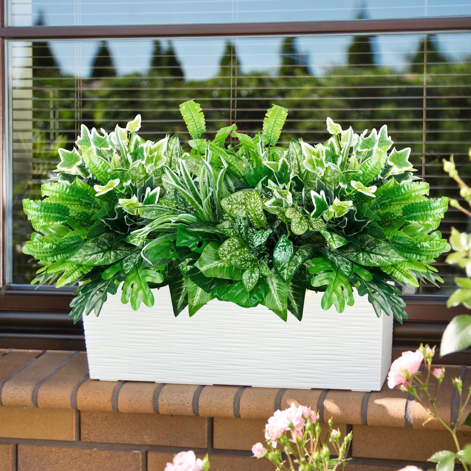 Obbsie artificial palm foliage adds tropical texture to patios.