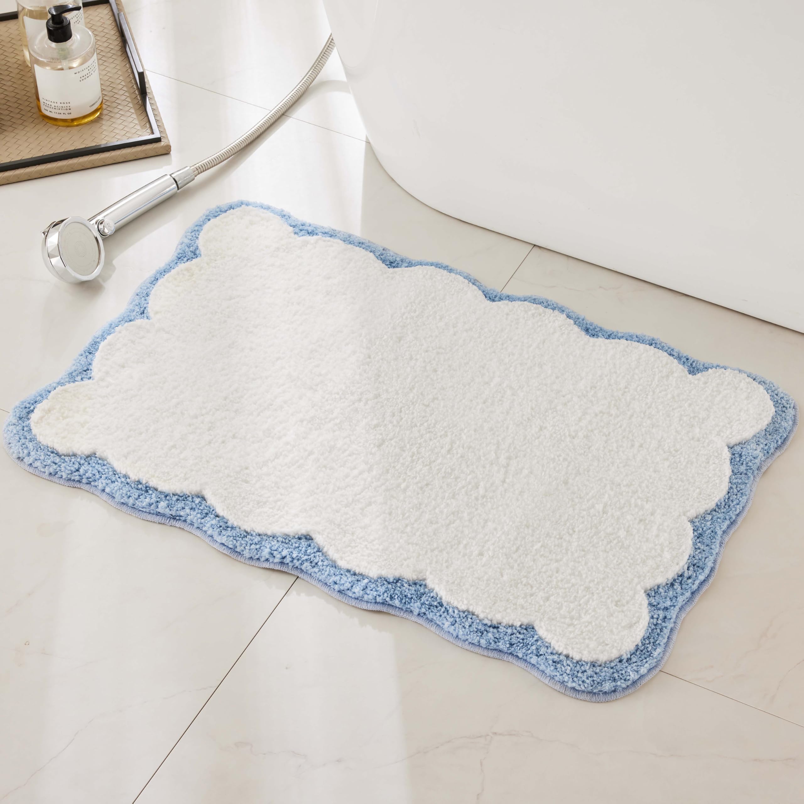 Ohocut luxury bath rug with white and blue scalloped piping adds plush style.