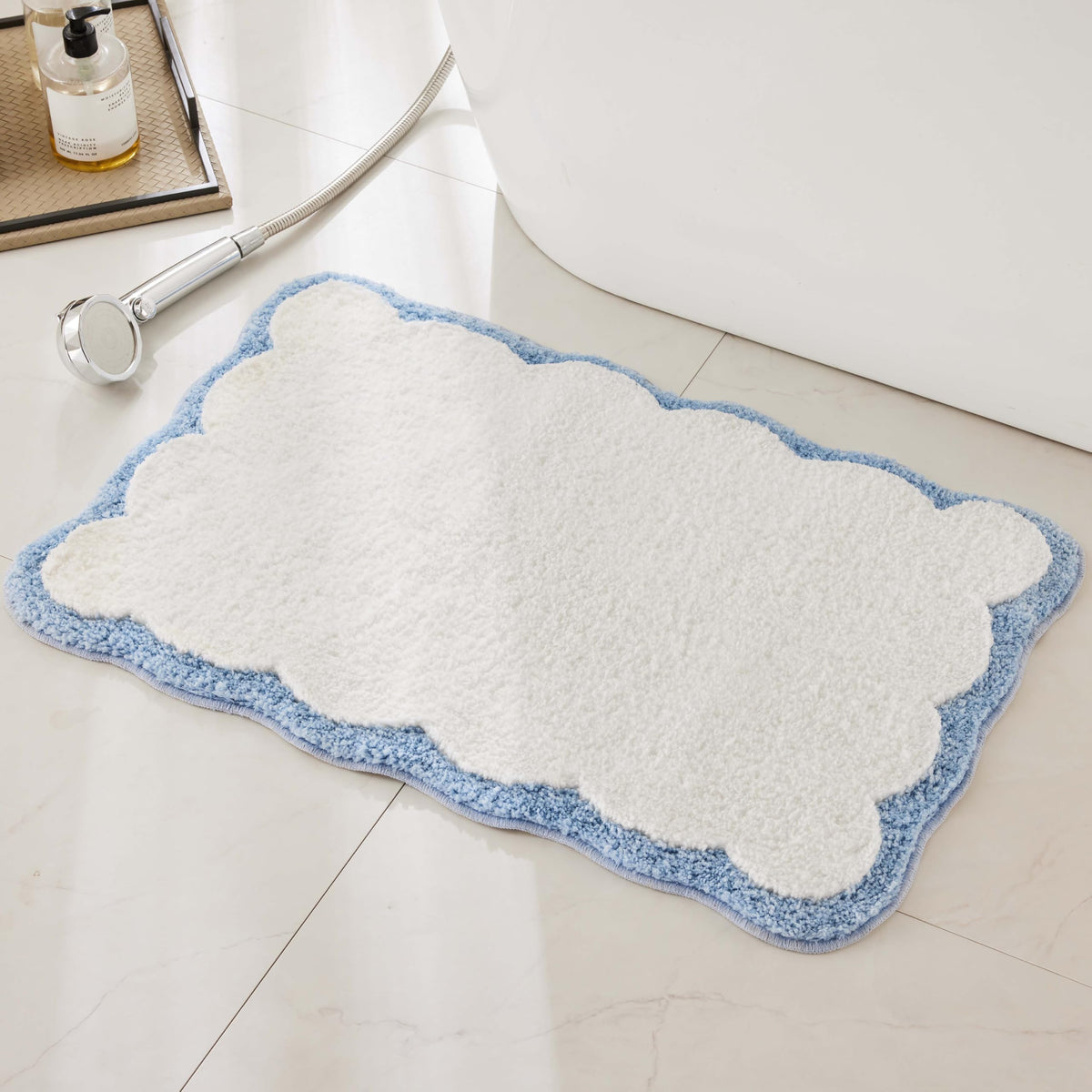 Ohocut luxury bath rug with white and blue scalloped piping adds plush style.
