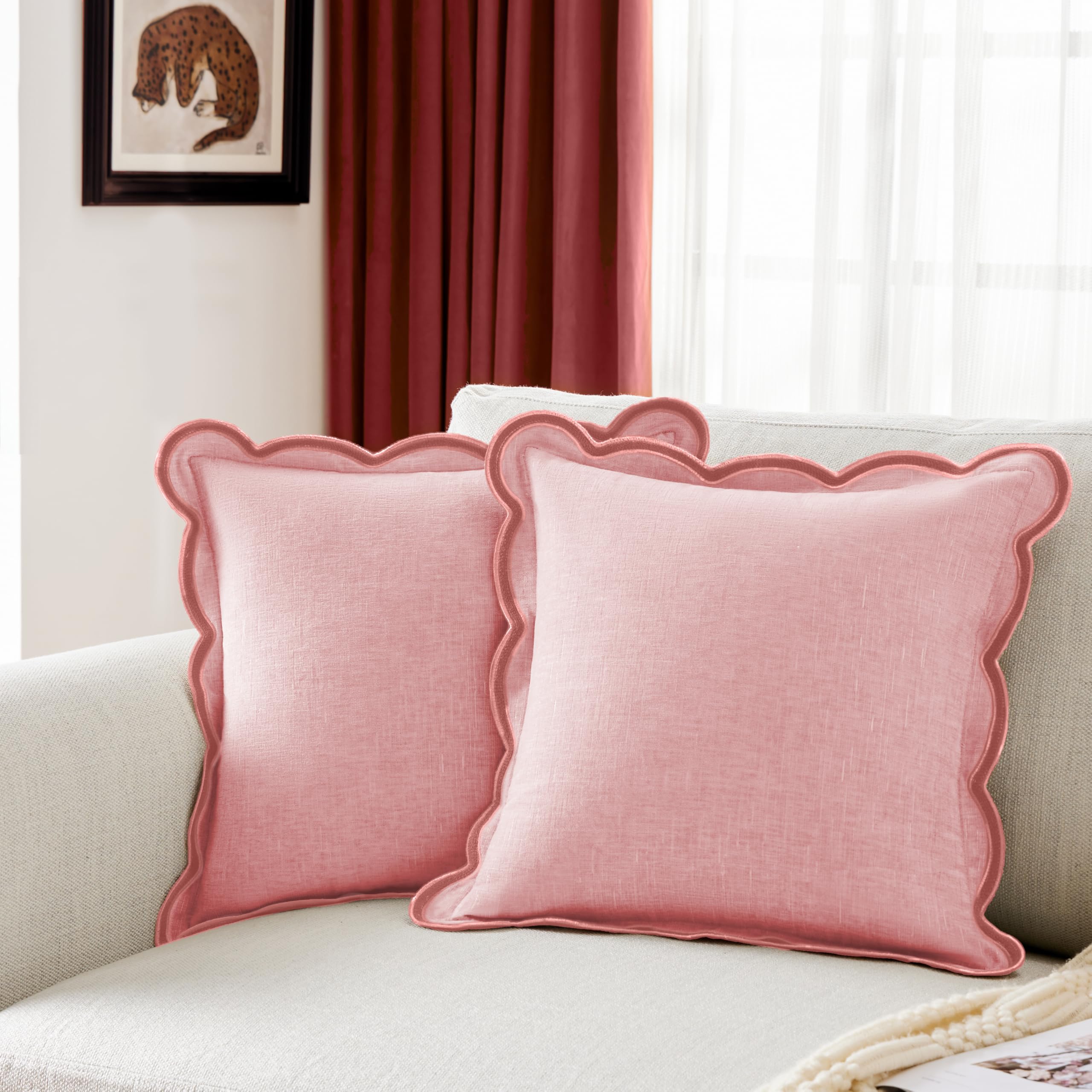 Ohocut scalloped-edge pillow cover in blush pink on a couch, adding elegant texture