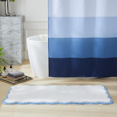 Ohocut white bath mat with blue scalloped piping complements modern bathrooms