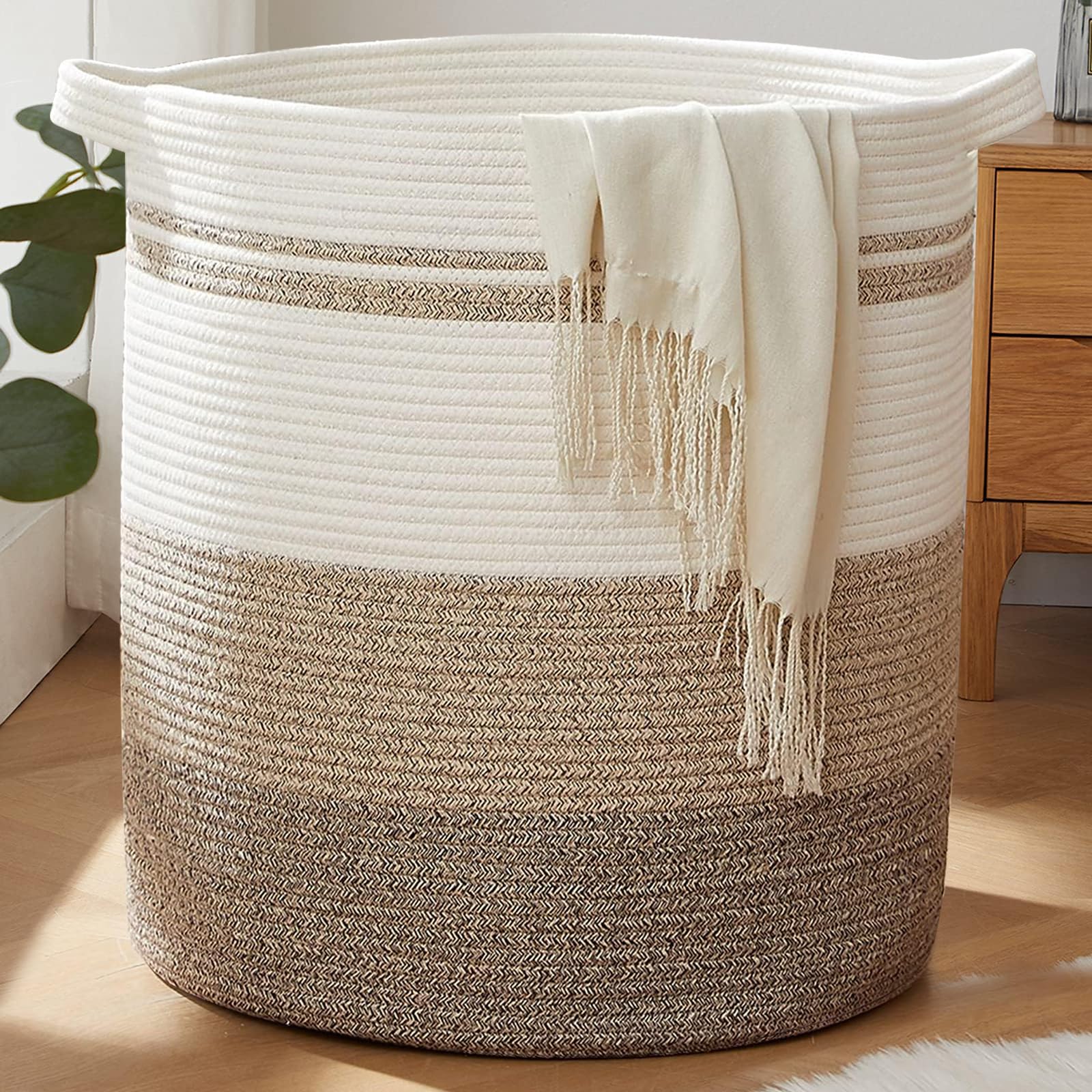 OIAHOMY 115L laundry basket with sturdy handles for easy transport.