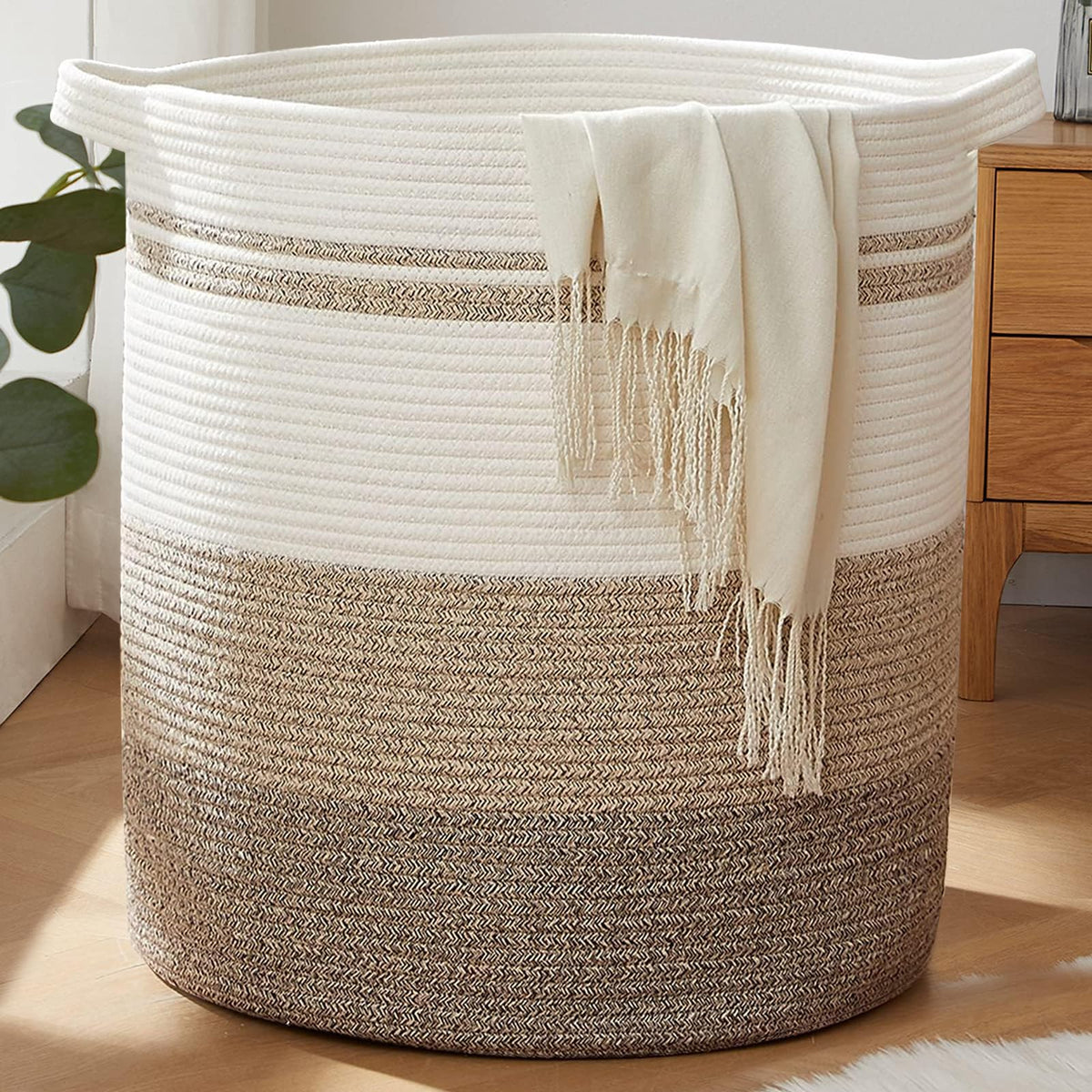 OIAHOMY 115L laundry basket with sturdy handles for easy transport.