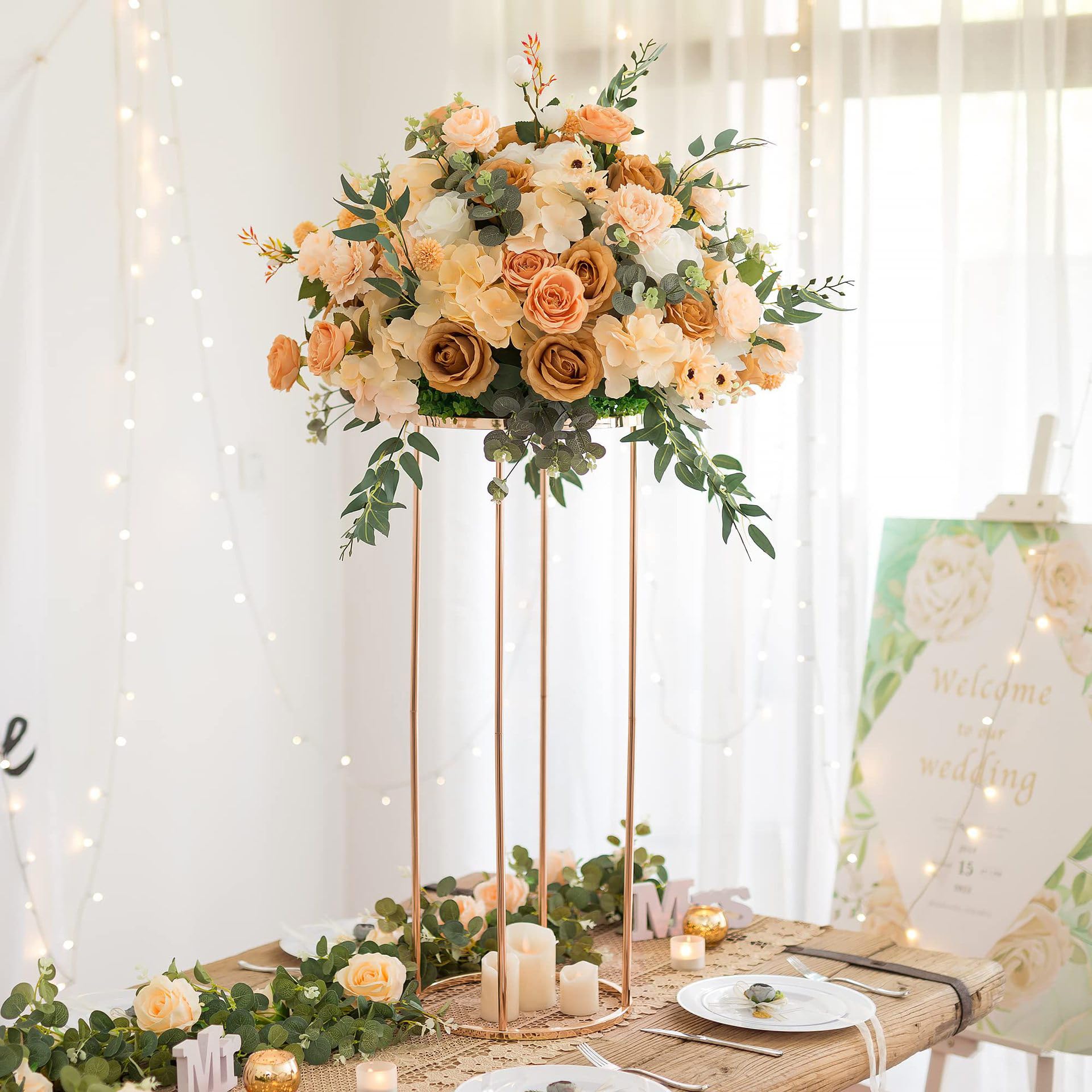 OIHYA rose gold cylinder stand showcases plants as a stylish dining accent.