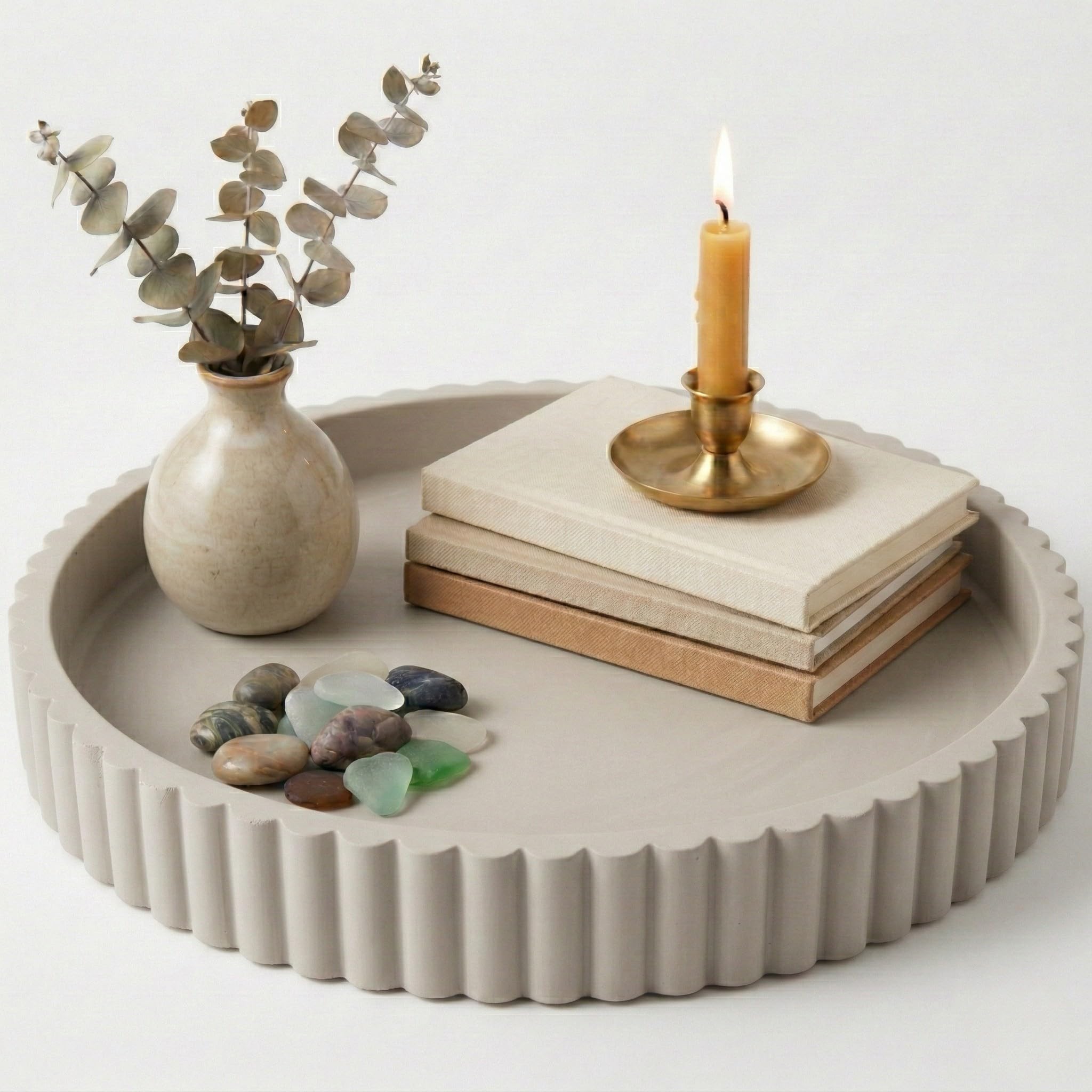 OAKOA round decorative concrete tray used as a stylish coffee table centerpiece
