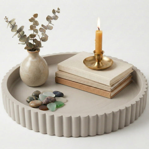 OAKOA round decorative concrete tray used as a stylish coffee table centerpiece