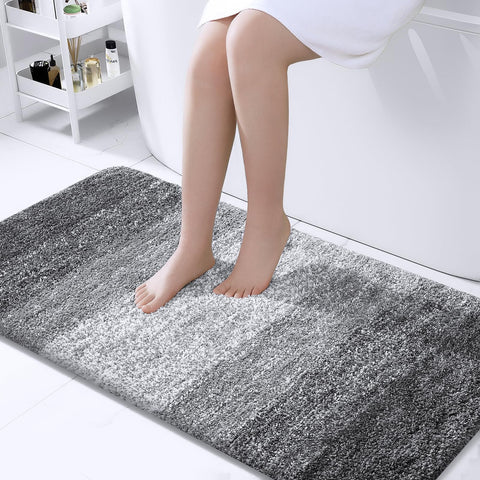 OLANLY bath mat with soft plush surface for cozy feet after showers.