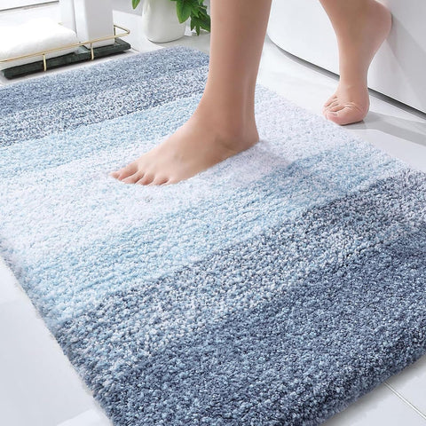 OLANLY bath rug closeup shows plush blue pile for cozy feet.