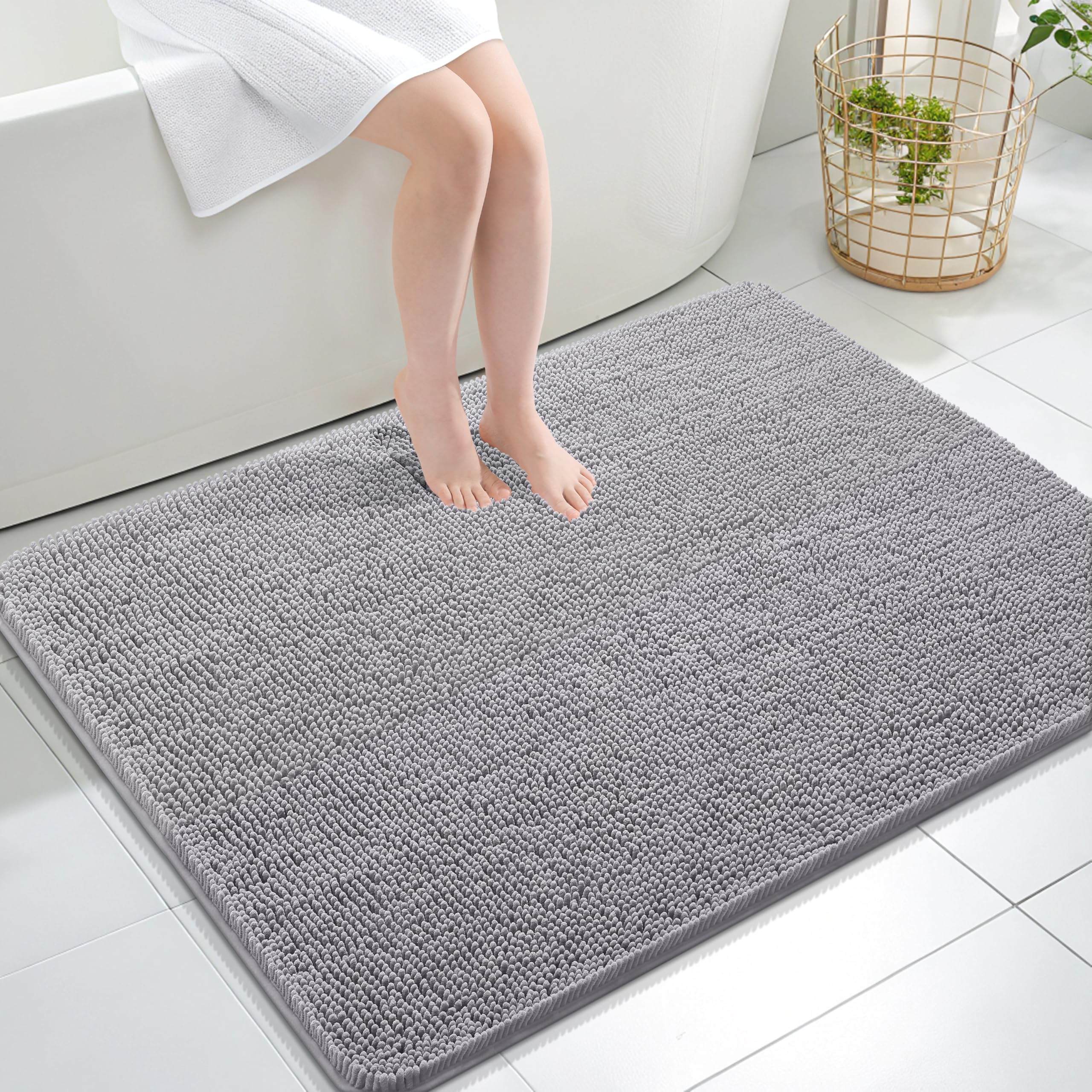 OLANLY bath rug with soft chenille pile for cozy feet after showers.