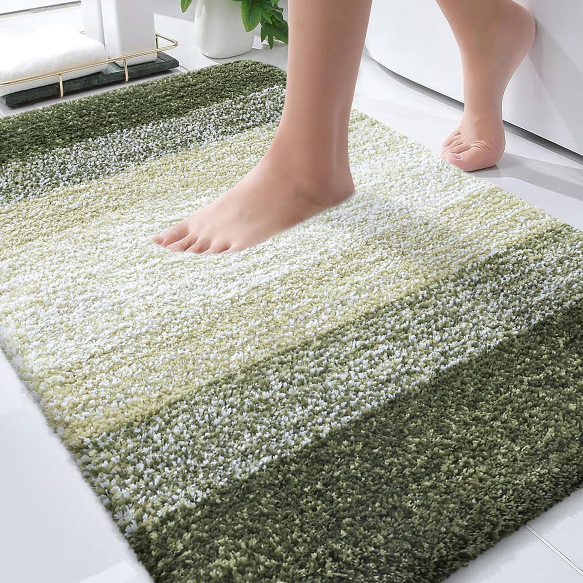 OLANLY bath rug with plush pile delivers soft comfort and warmth underfoot.