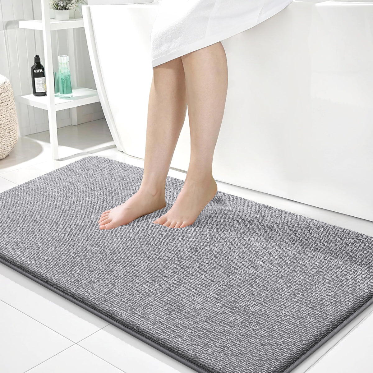 OLANLY thick memory foam bath mat in gray offers cloud-like comfort by the tub.