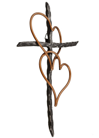 Old River Outdoors Two Hearts cross hung above mantel adds warm symbolism.