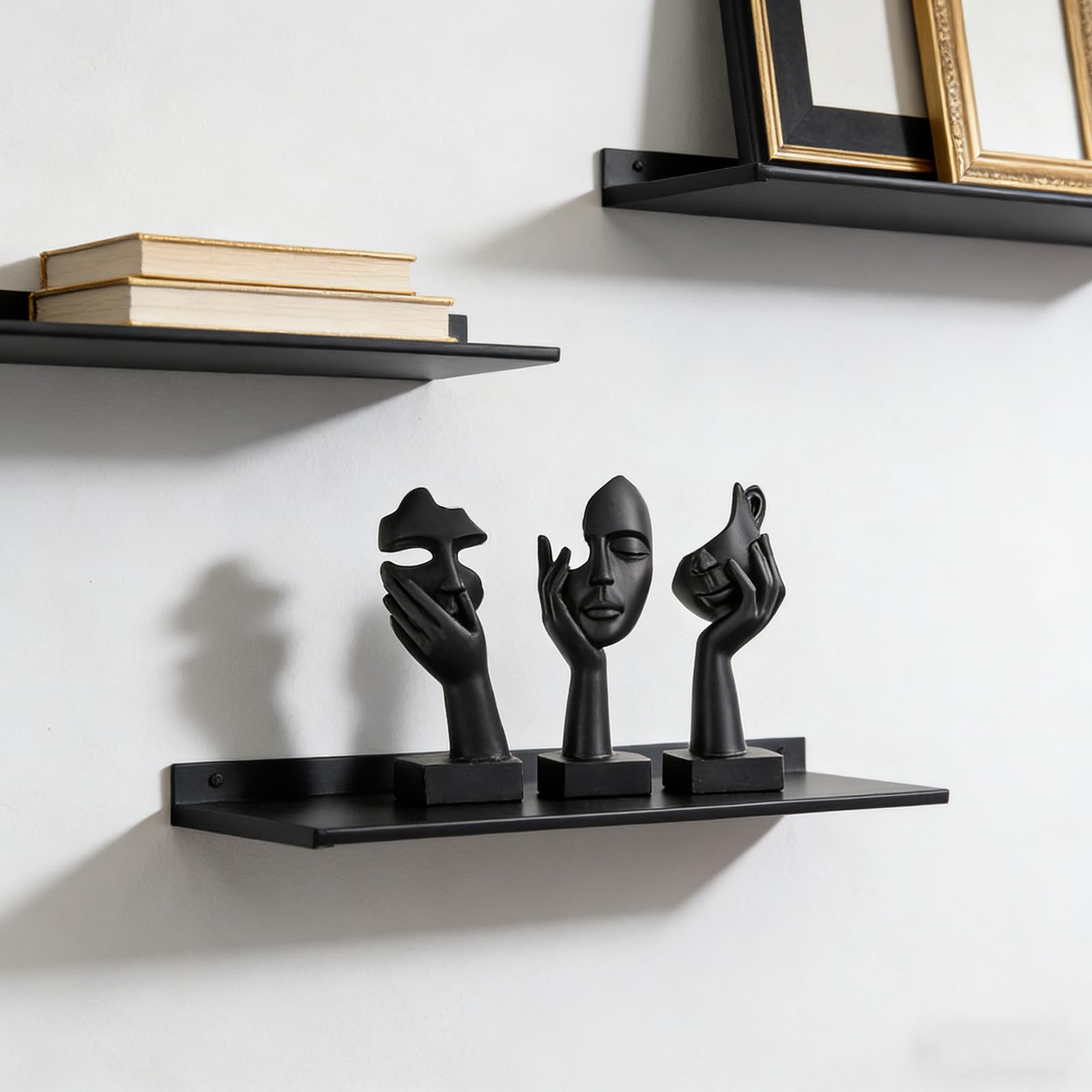 oliruim thinker-face-black-gold statue serves as a striking coffee table centerpiece
