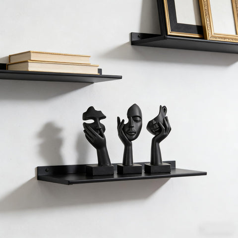 oliruim thinker-face-black-gold statue serves as a striking coffee table centerpiece