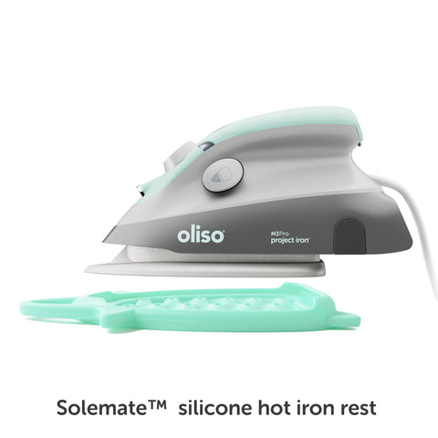 Oliso M3Pro steam on demand button shows controlled pressing action
