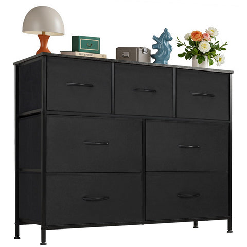OLIXIS dresser with wooden top provides a sturdy surface for daily essentials.