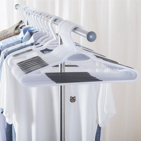 Ollieroo bendable grey hangers with integrated clips hold skirts and pants neatly.