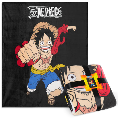 One Piece fleece throw blanket on a couch adds cozy anime style for relaxed evenings.