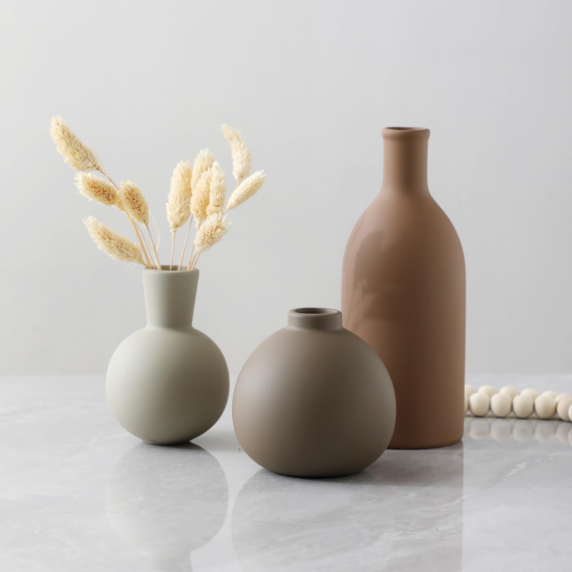 OOIT ceramic vase set of 3 brown finish complements natural tones in any room.