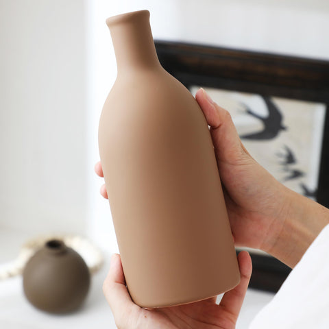 OOIT ceramic vase set of 3 mid vase detail emphasizes sturdy terra cotta and smooth curves.