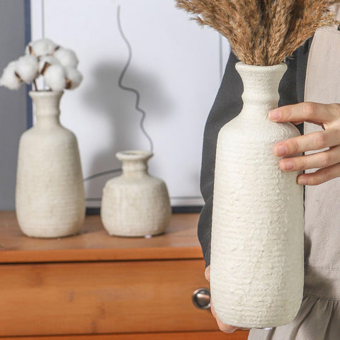 OOIT vases in whitewashed finish, versatile for fresh or dried arrangements.
