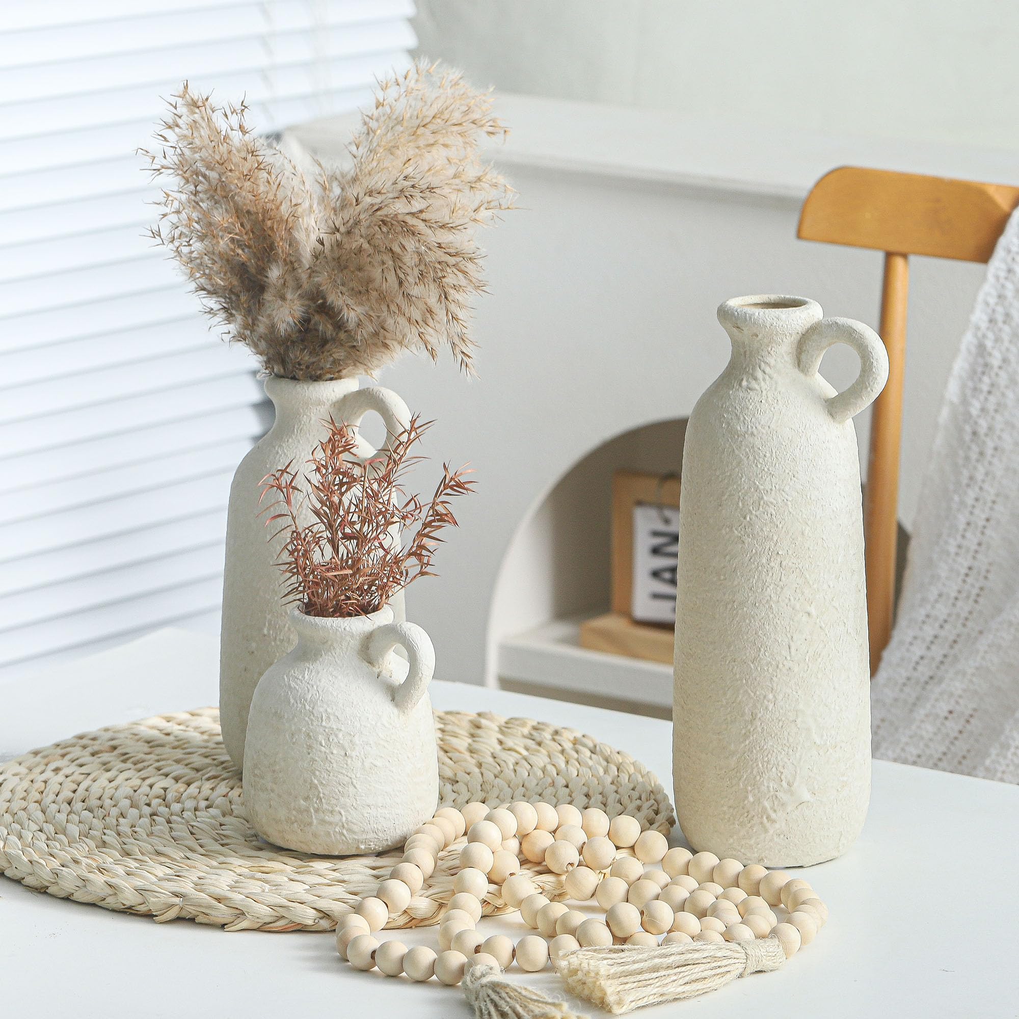 Living room setup with three vases on a shelf