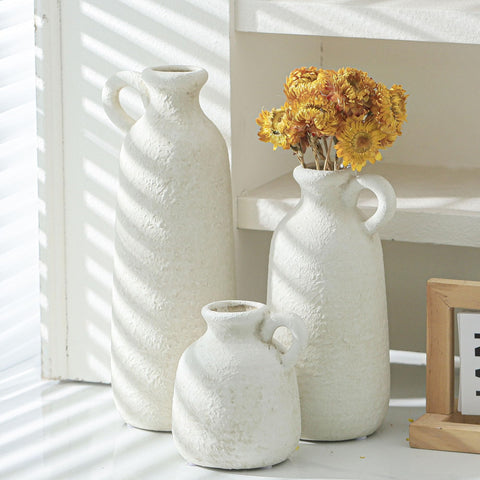 Table centerpiece showing three distinct vase shapes