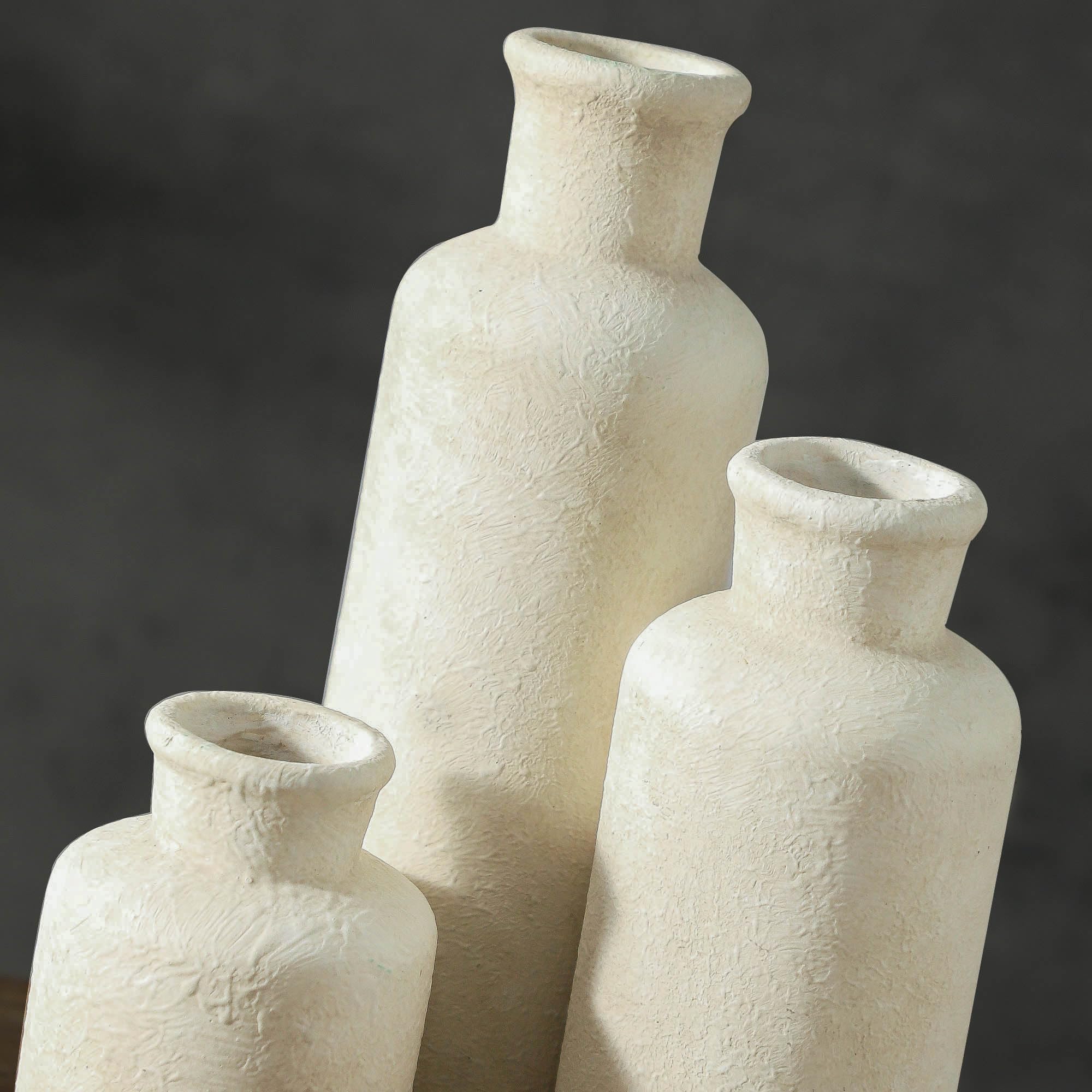 ooit whitewashed vases arranged as centerpiece with greenery