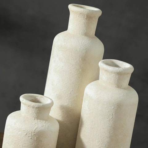 ooit whitewashed vases arranged as centerpiece with greenery