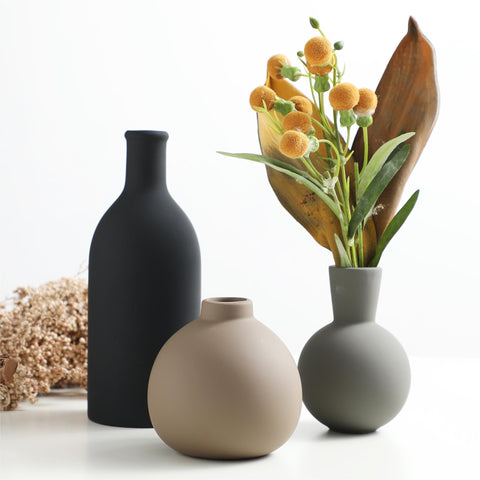 OOIT vase trio displaying dried and fresh blooms on a shelf