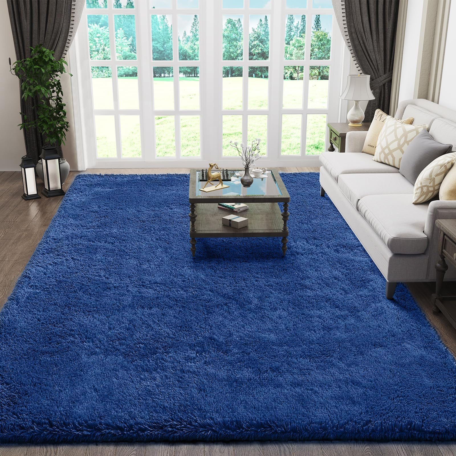 Ophanie 5x8 blue shag rug in living room adds warm, plush comfort.