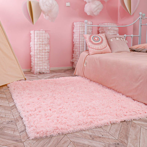 Ophanie dorm room rug in pink creates a cozy study nook.