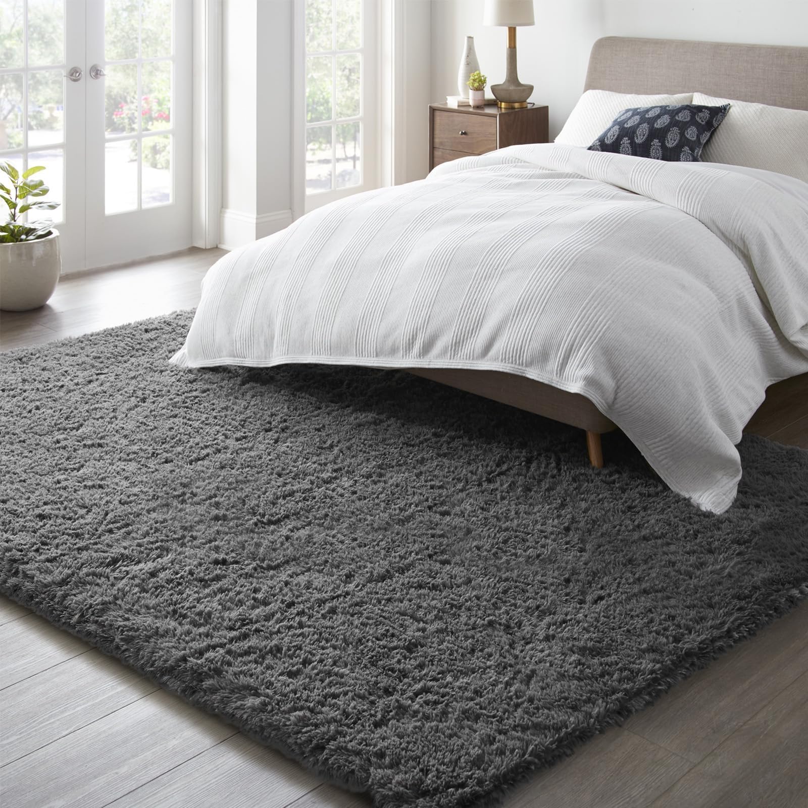 Ophanie layered-design shag rug enhances hygge-style warmth and space definition.
