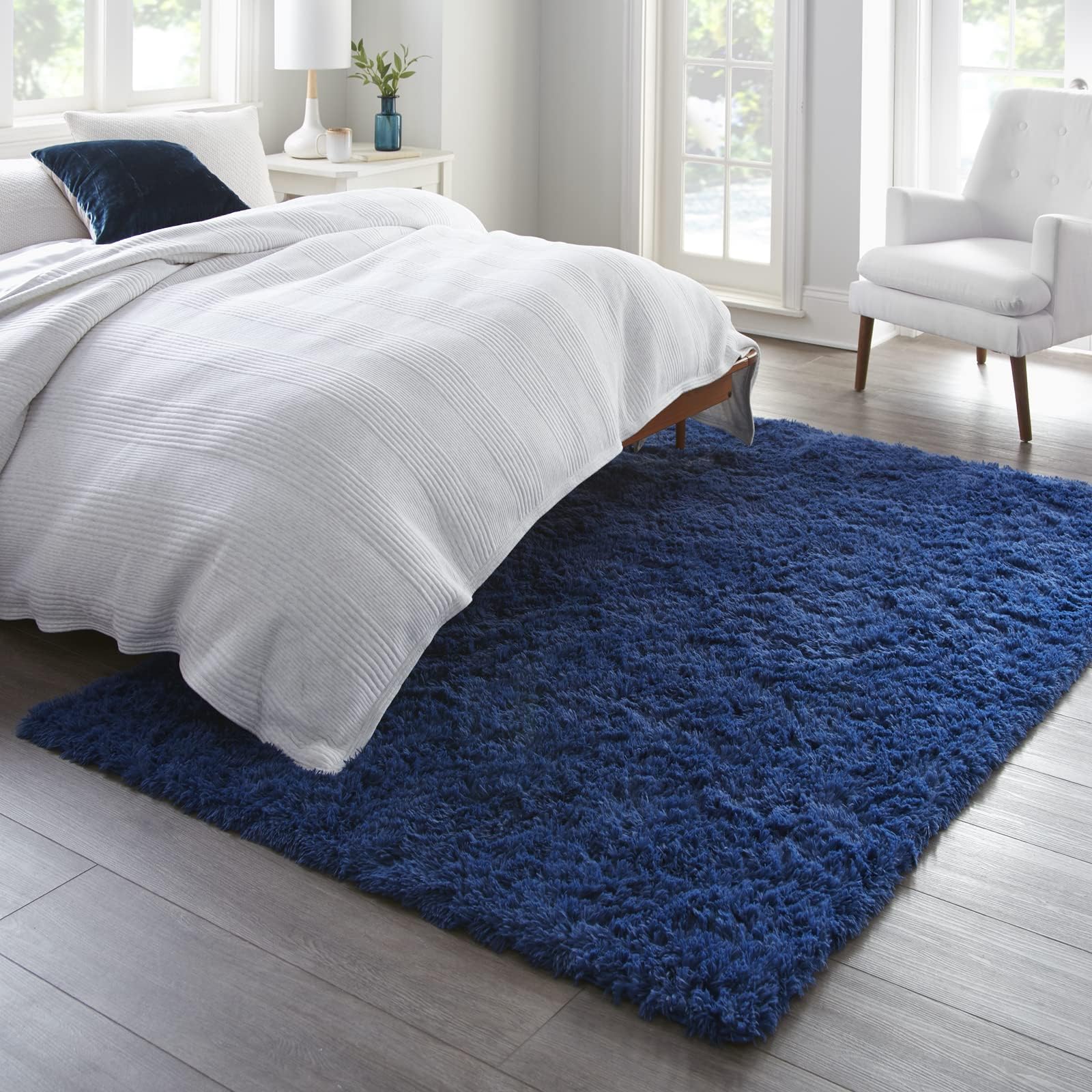 Ophanie navy nursery rug provides soft surface for tummy time.