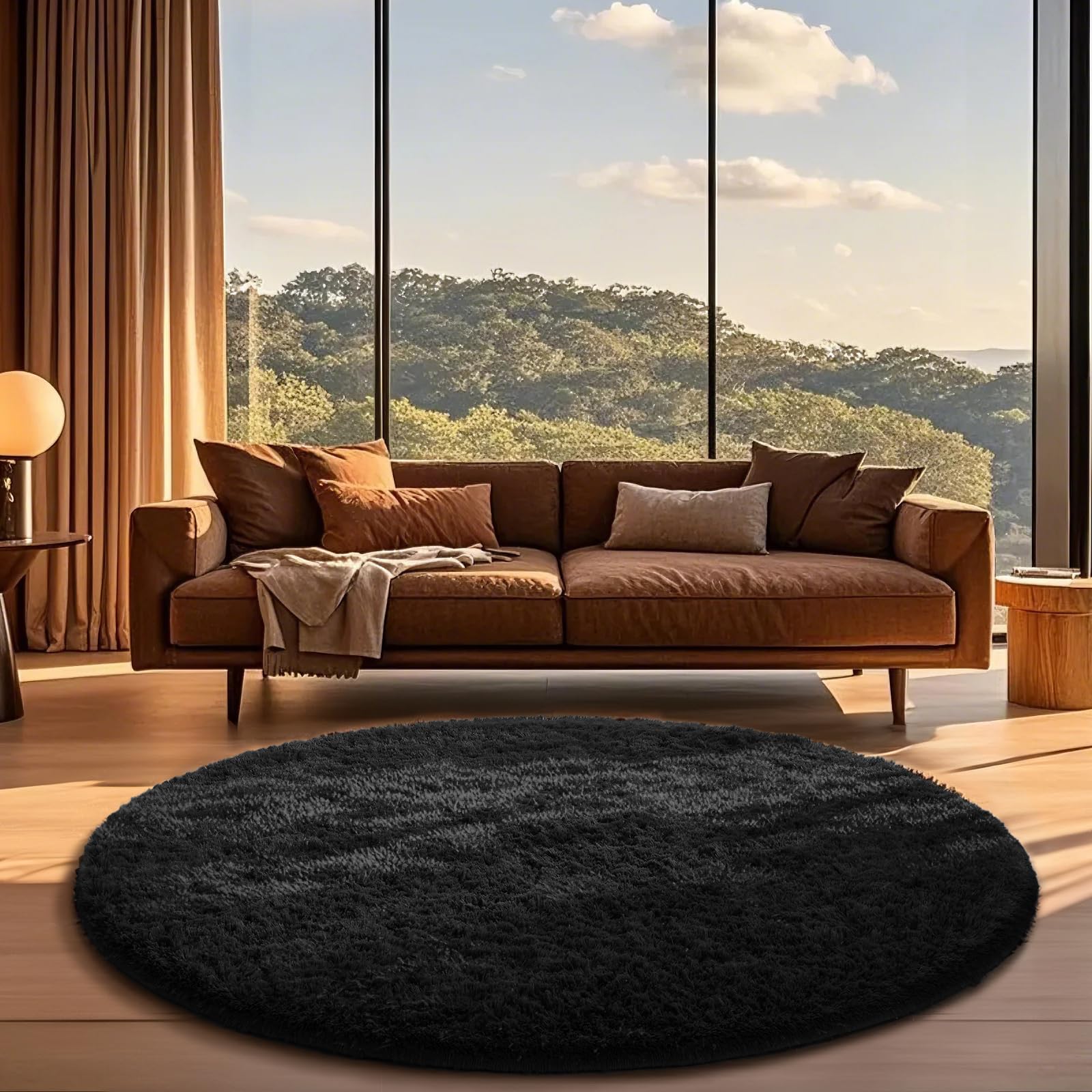 Ophanie round rug 6ft black with fluffy texture adds cozy living room style.