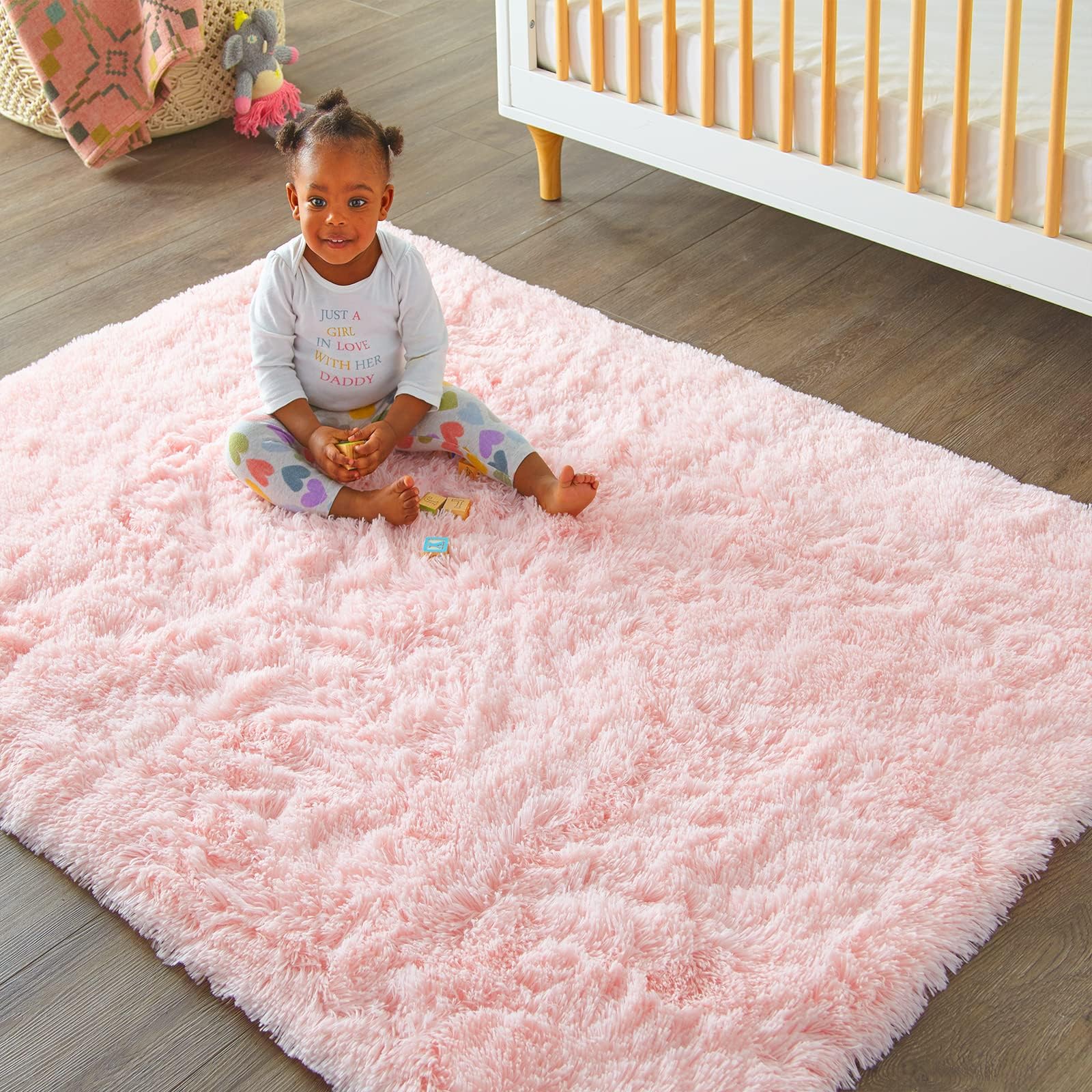 Ophanie solid pink rug adds modern, simple decor.