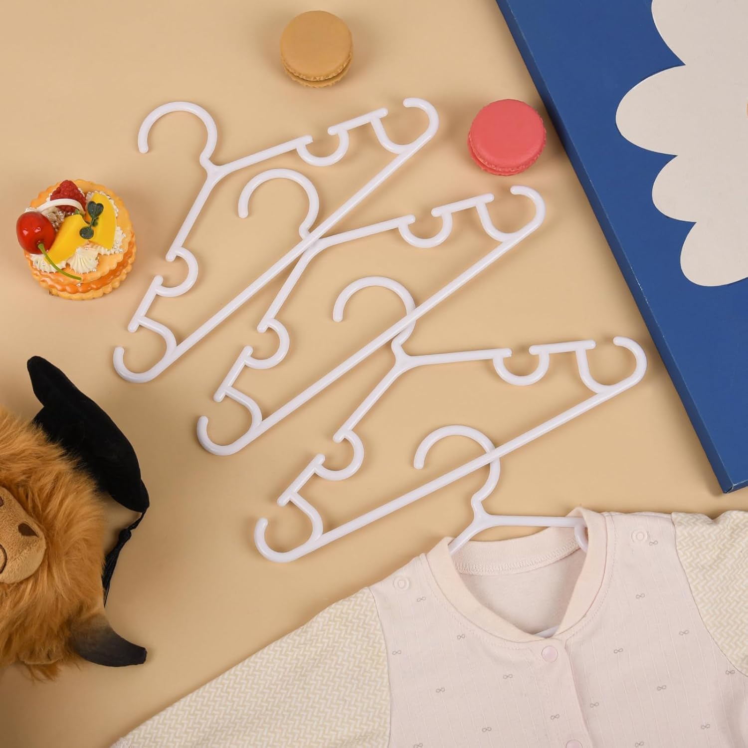 Oppeeye versatile baby clothes hangers for shirts, dresses, coats, and accessories.