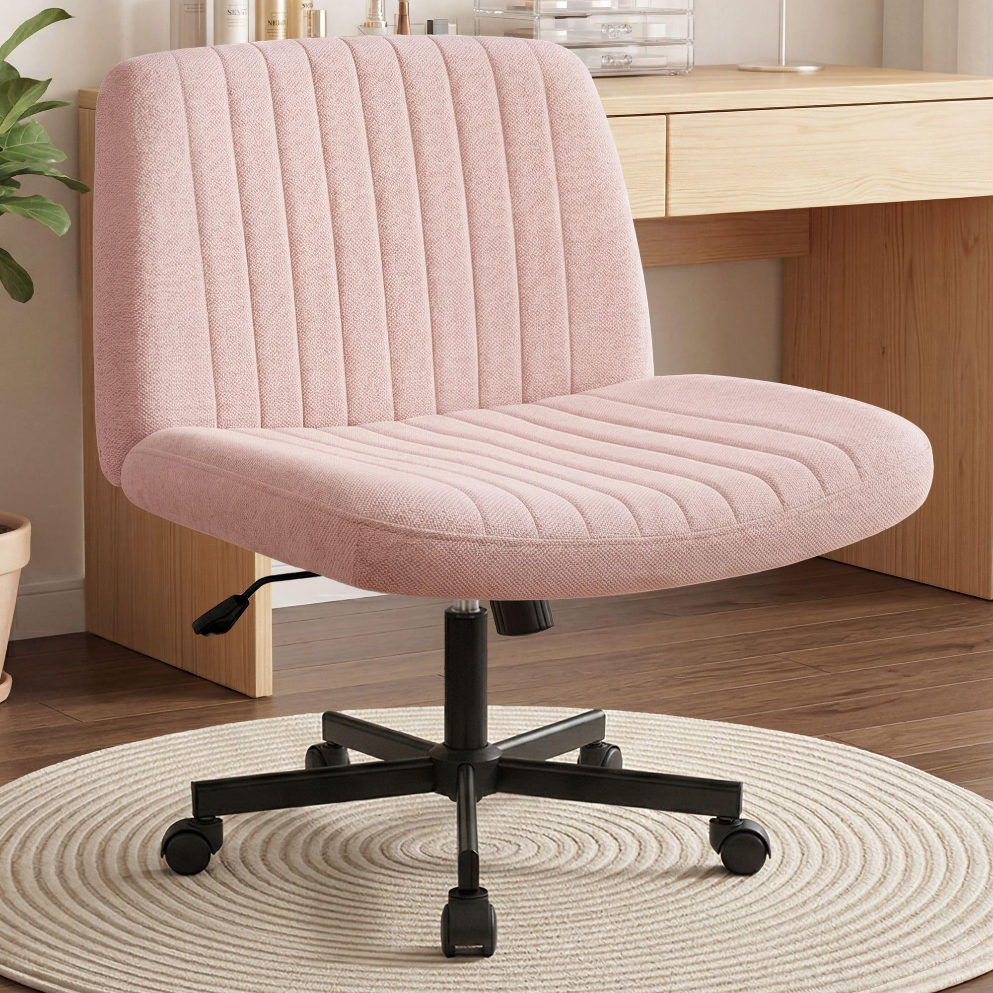 Orange Factory Criss Cross chair wheels with wide cross-legged seat for comfort.