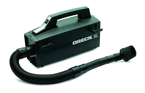 Oreck Super-Deluxe carry strap shows portability for stairs and overhead tasks