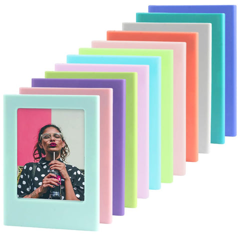 Orga'Neat Instax mini fridge frame on a metal surface for stylish photo display.