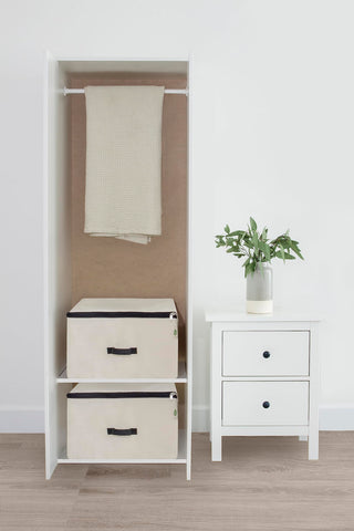 Stacked Organic Cotton Mart bags in a closet for organization.