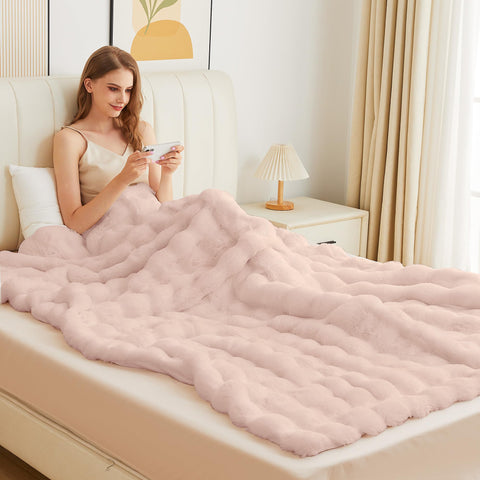 ORINOVA pink fluffy blanket on bed showcases generous 50x60 size