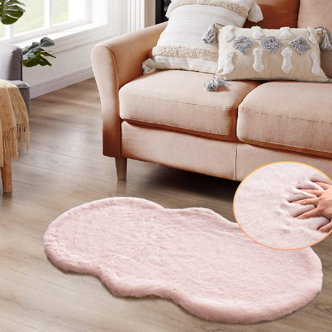 ORINOVA pink fuzzy rug close-up shows soft faux fur texture for cozy feet.