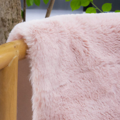 ORINOVA pink fuzzy rug 2x4ft in living room setup for warm ambiance.